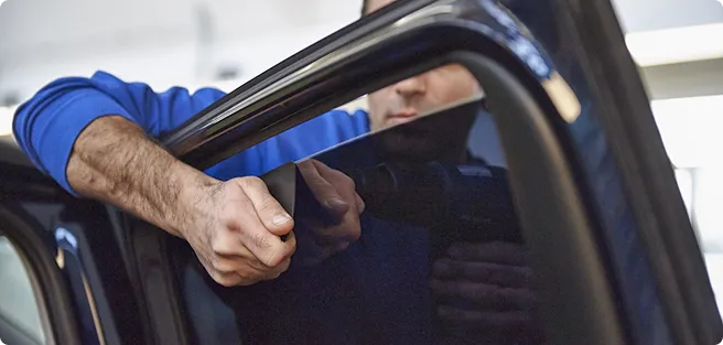 Man opening a car window